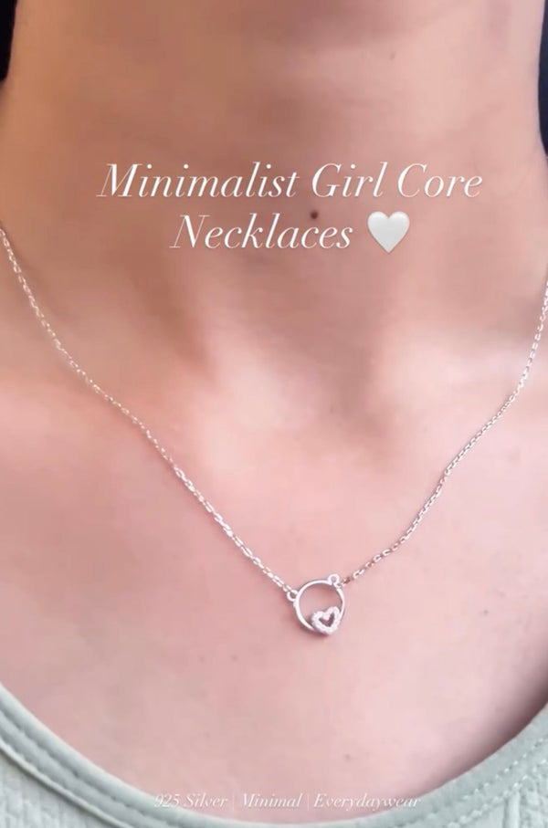 Circle with heart design silver necklace